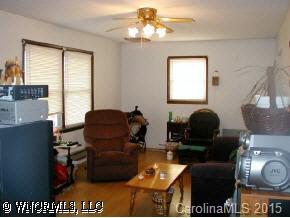 22 Tyler Street Clyde, NC 28721 - Photo 2 of 9 a living room with furniture and a window