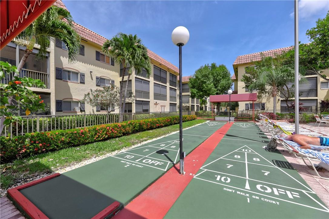 253 South Cypress Road, Unit 246 Pompano Beach, FL 33060 - Photo 12 of 33 a view of an outdoor space and deck