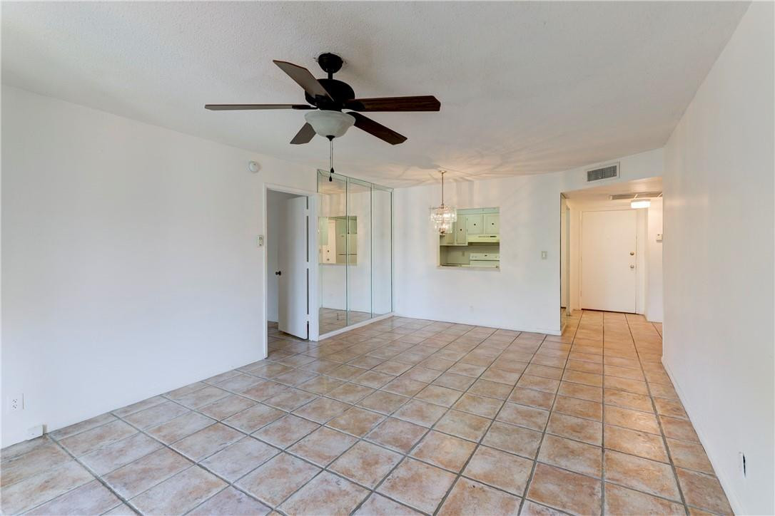 253 South Cypress Road, Unit 246 Pompano Beach, FL 33060 - Photo 16 of 33 a view of empty room with wooden floor and ceiling fan