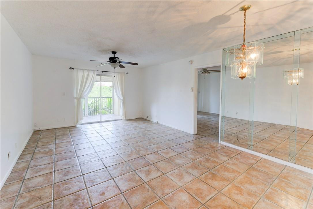 253 South Cypress Road, Unit 246 Pompano Beach, FL 33060 - Photo 17 of 33 a view of an empty room with a window