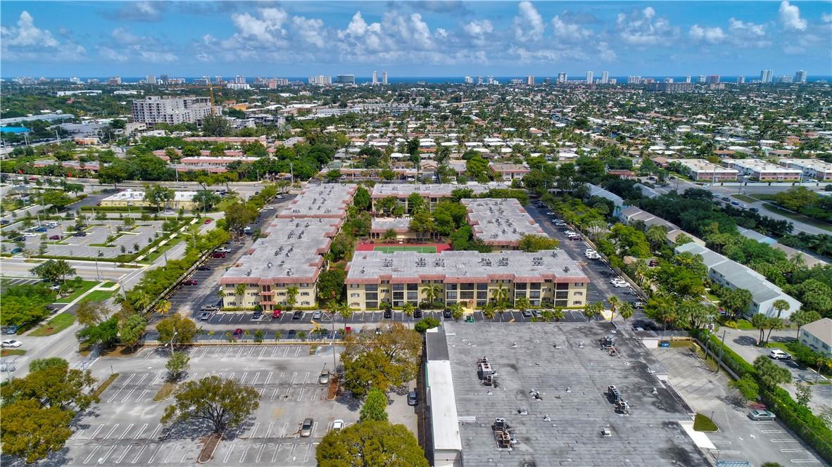 253 South Cypress Road, Unit 246 Pompano Beach, FL 33060 - Photo 2 of 33 an aerial view of residential houses with outdoor space