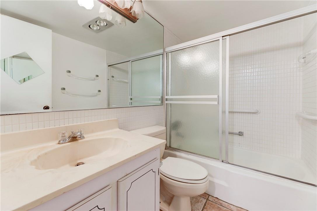 253 South Cypress Road, Unit 246 Pompano Beach, FL 33060 - Photo 27 of 33 a bathroom with a sink toilet and shower