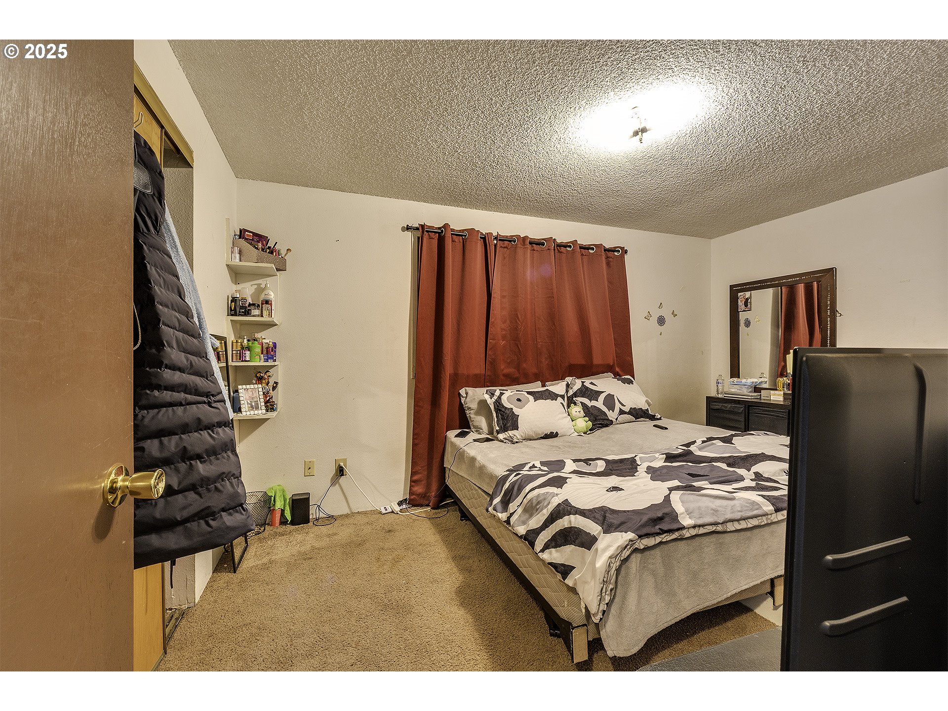 2724 North Davis Court Cornelius, OR 97113 - Photo 12 of 26 a bed sitting in a bedroom next to a window and dresser
