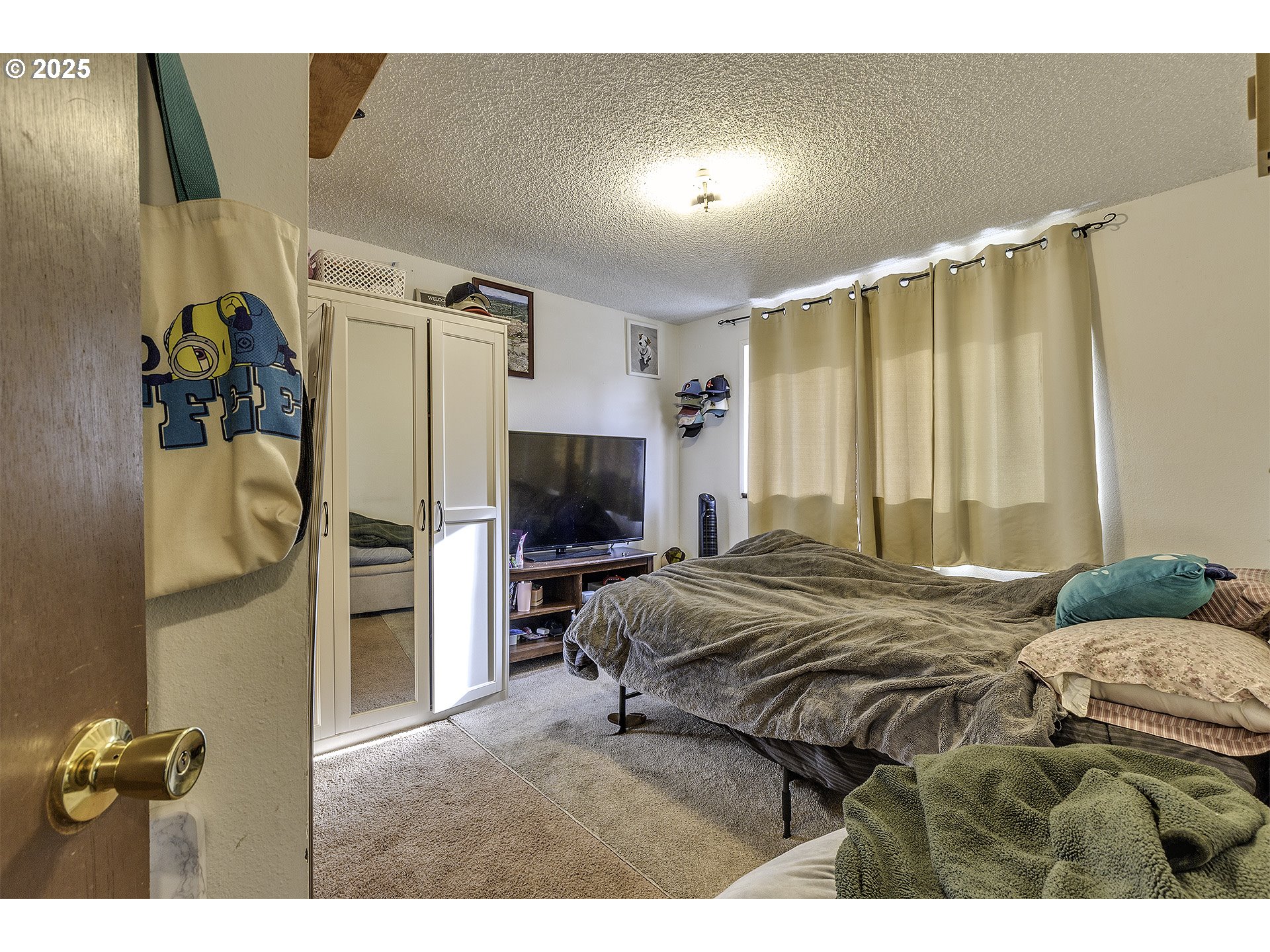 2724 North Davis Court Cornelius, OR 97113 - Photo 13 of 26 a bedroom with a bed and a television