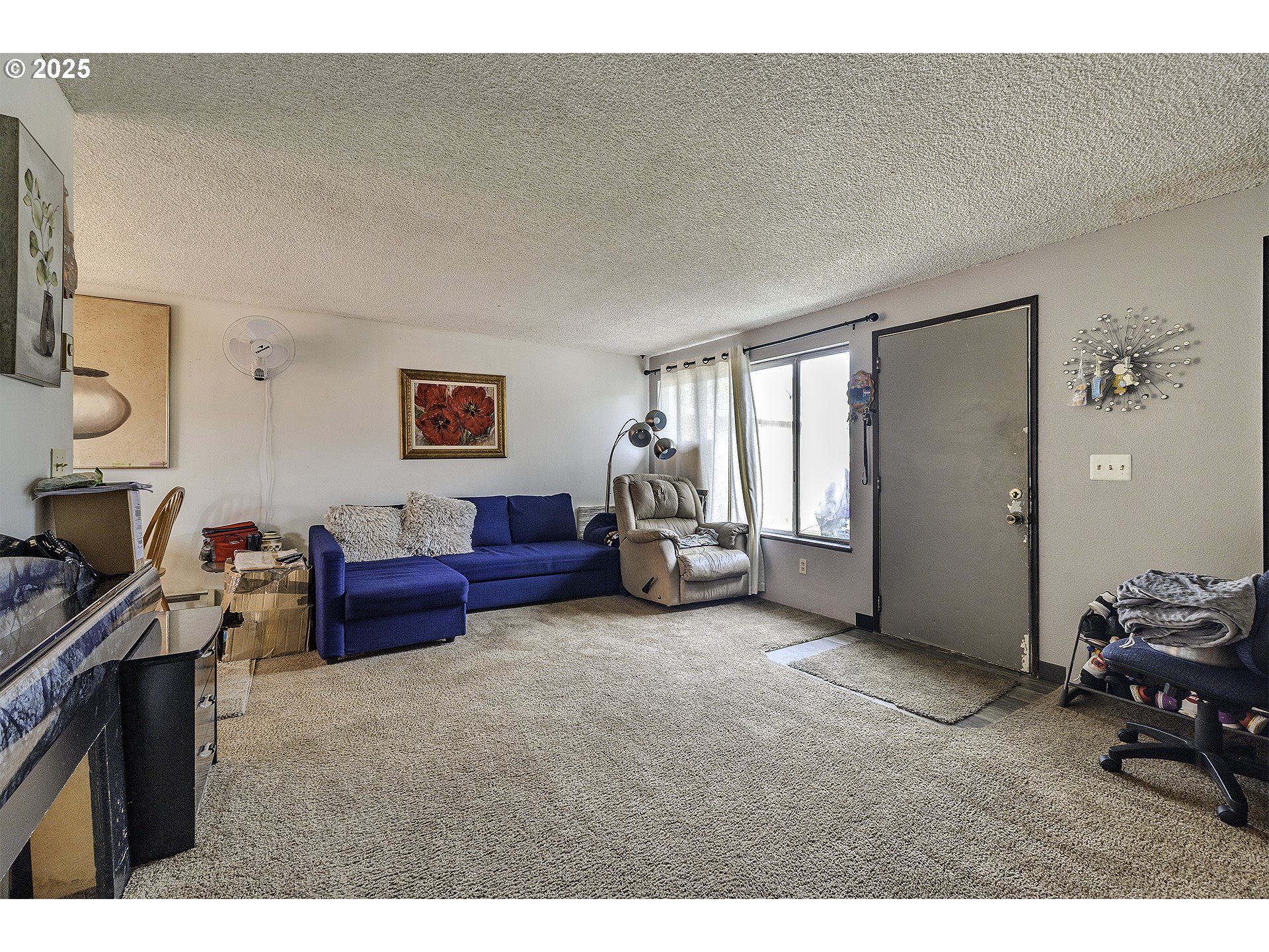 2724 North Davis Court Cornelius, OR 97113 - Photo 17 of 26 a living room with furniture and a flat screen tv