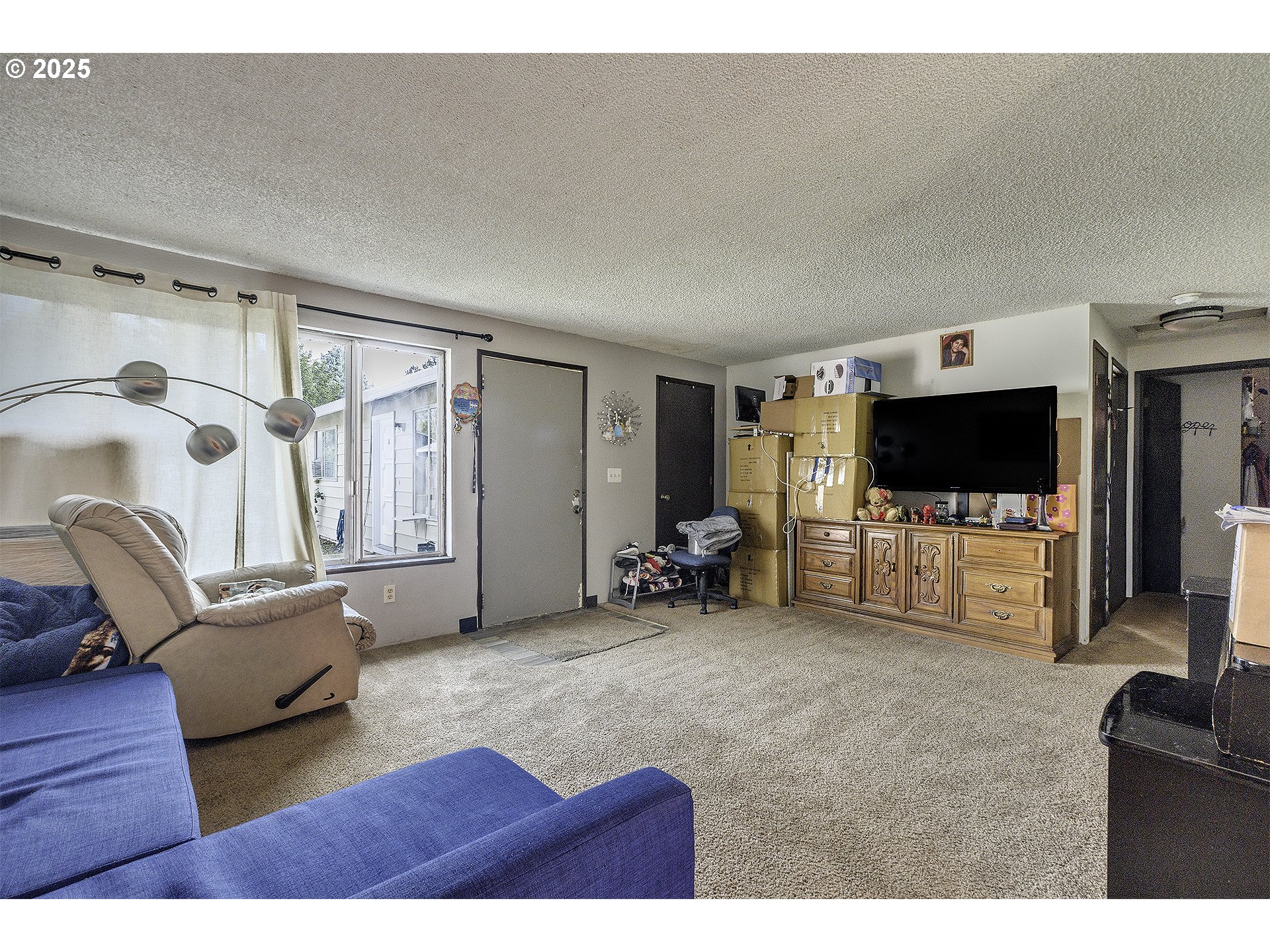 2724 North Davis Court Cornelius, OR 97113 - Photo 18 of 26 a living room with furniture and a flat screen tv