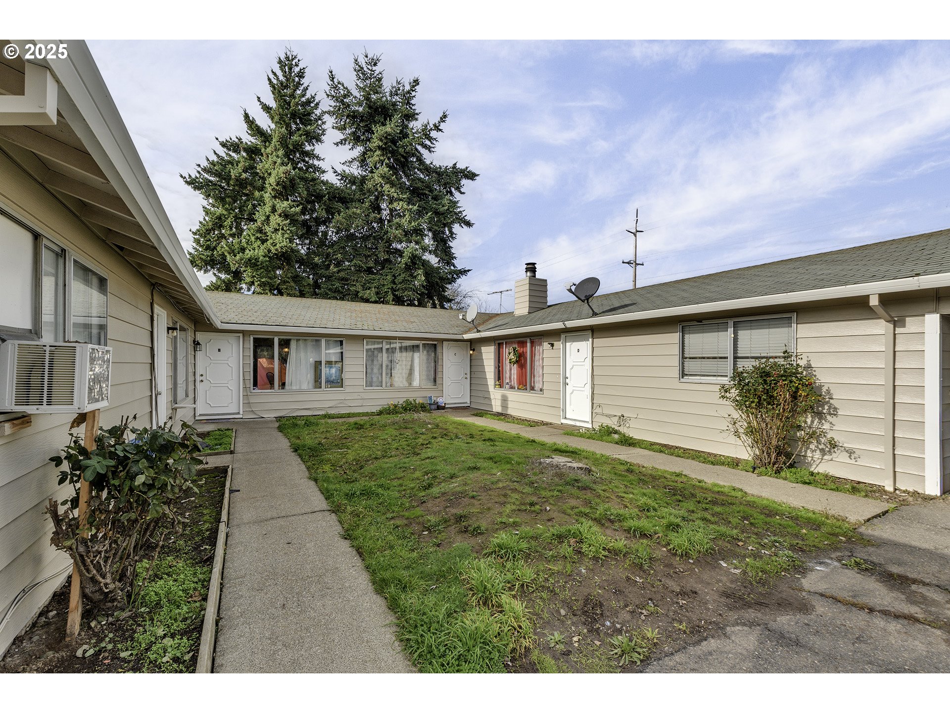 2724 North Davis Court Cornelius, OR 97113 - Photo 4 of 26 a view of a house with a yard and potted plants