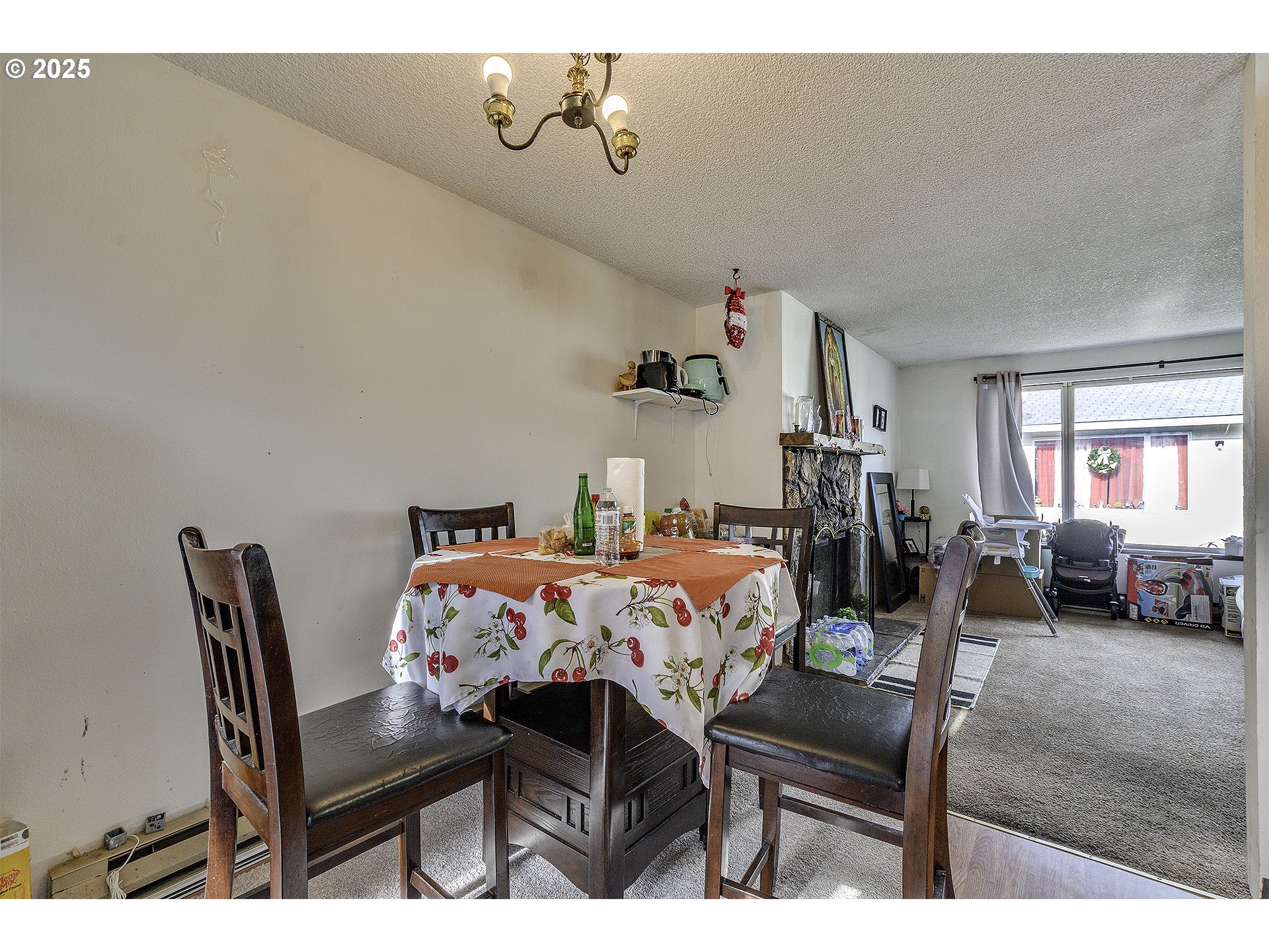 2724 North Davis Court Cornelius, OR 97113 - Photo 9 of 26 a view of a dining room with furniture and a chandelier