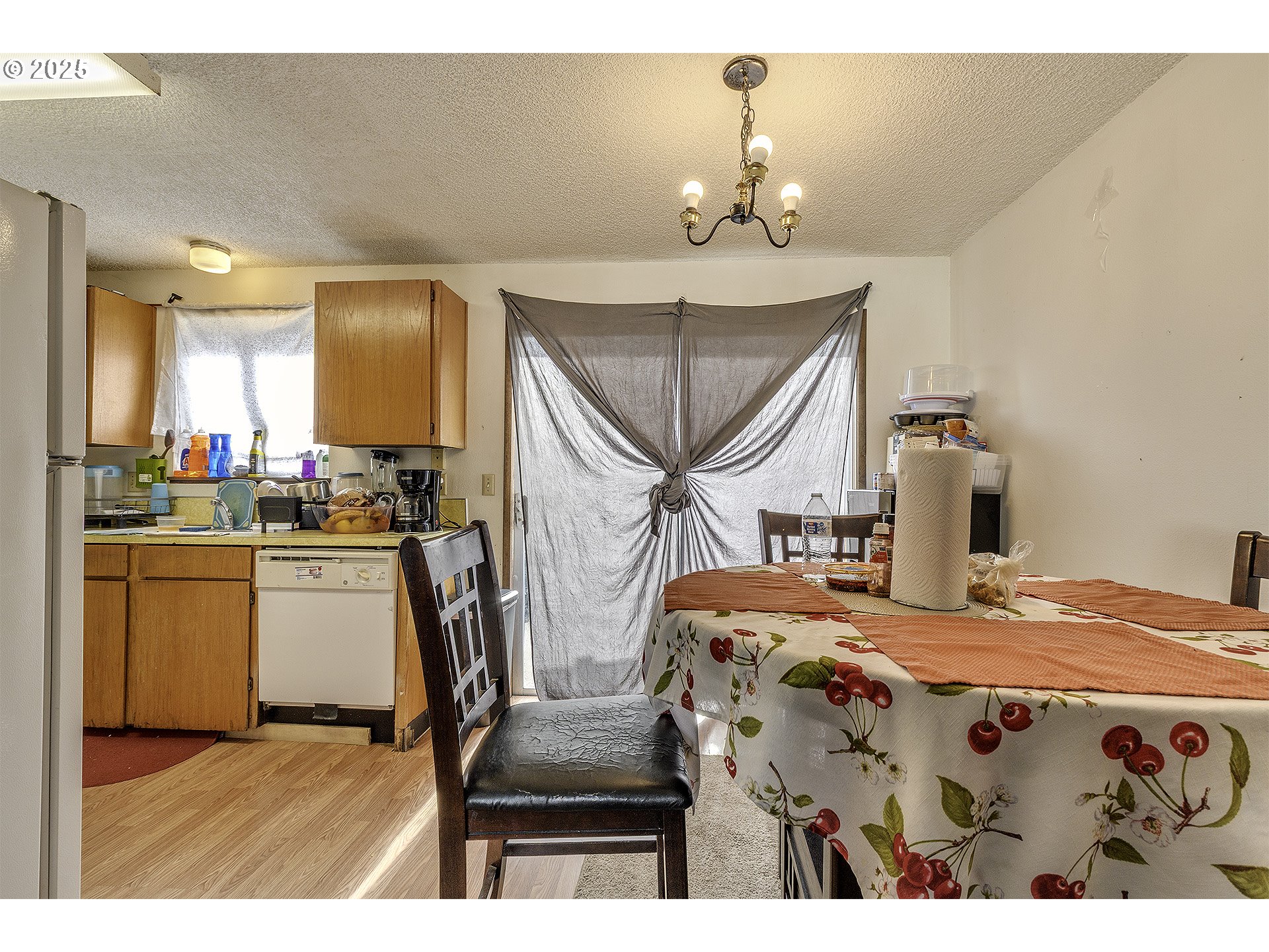 2724 North Davis Court Cornelius, OR 97113 - Photo 10 of 26 a kitchen with stainless steel appliances kitchen island a chandelier