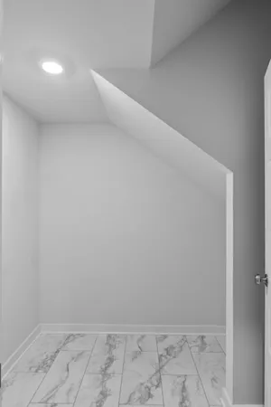 a bathroom with a shower sink and mirror