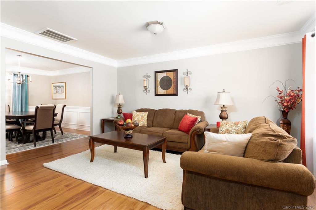 1703 Newland Road, Unit 124 Denver, NC 28037 - Photo 2 of 11 a living room with furniture and wooden floor