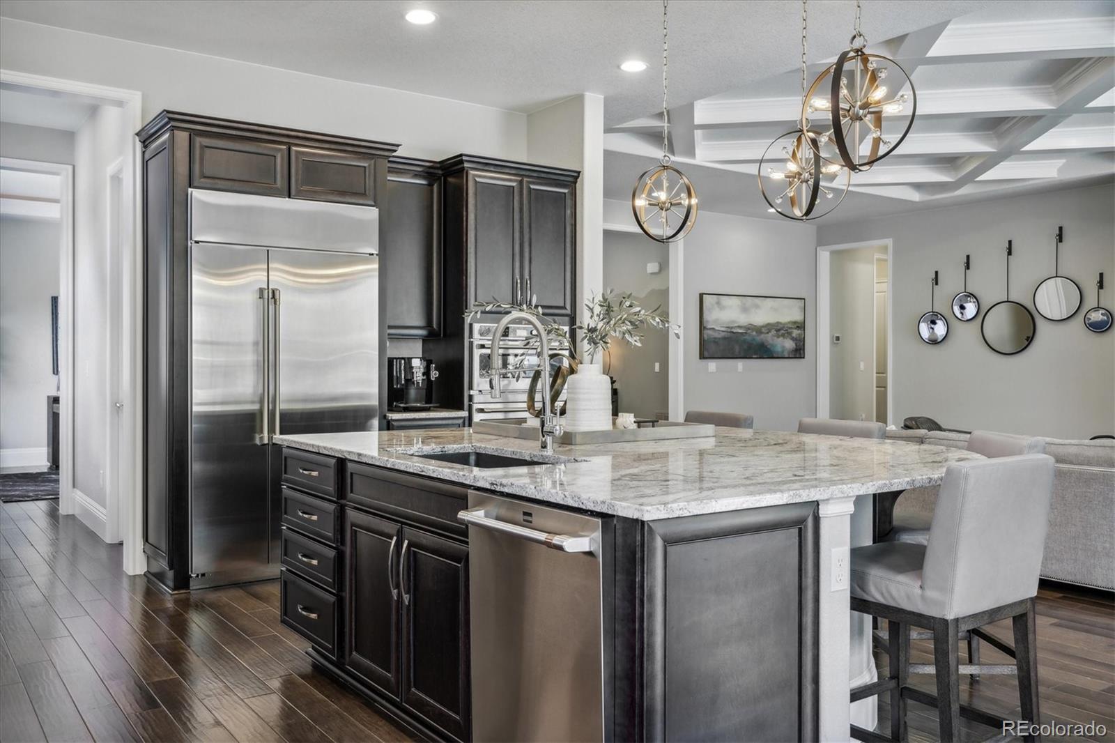 4837 Hogback Ridge Road Morrison, CO 80465 - Photo 15 of 40 a kitchen with a table and chairs in it