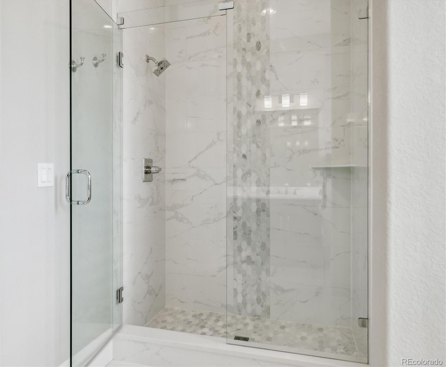 4837 Hogback Ridge Road Morrison, CO 80465 - Photo 23 of 40 a bathroom with a shower
