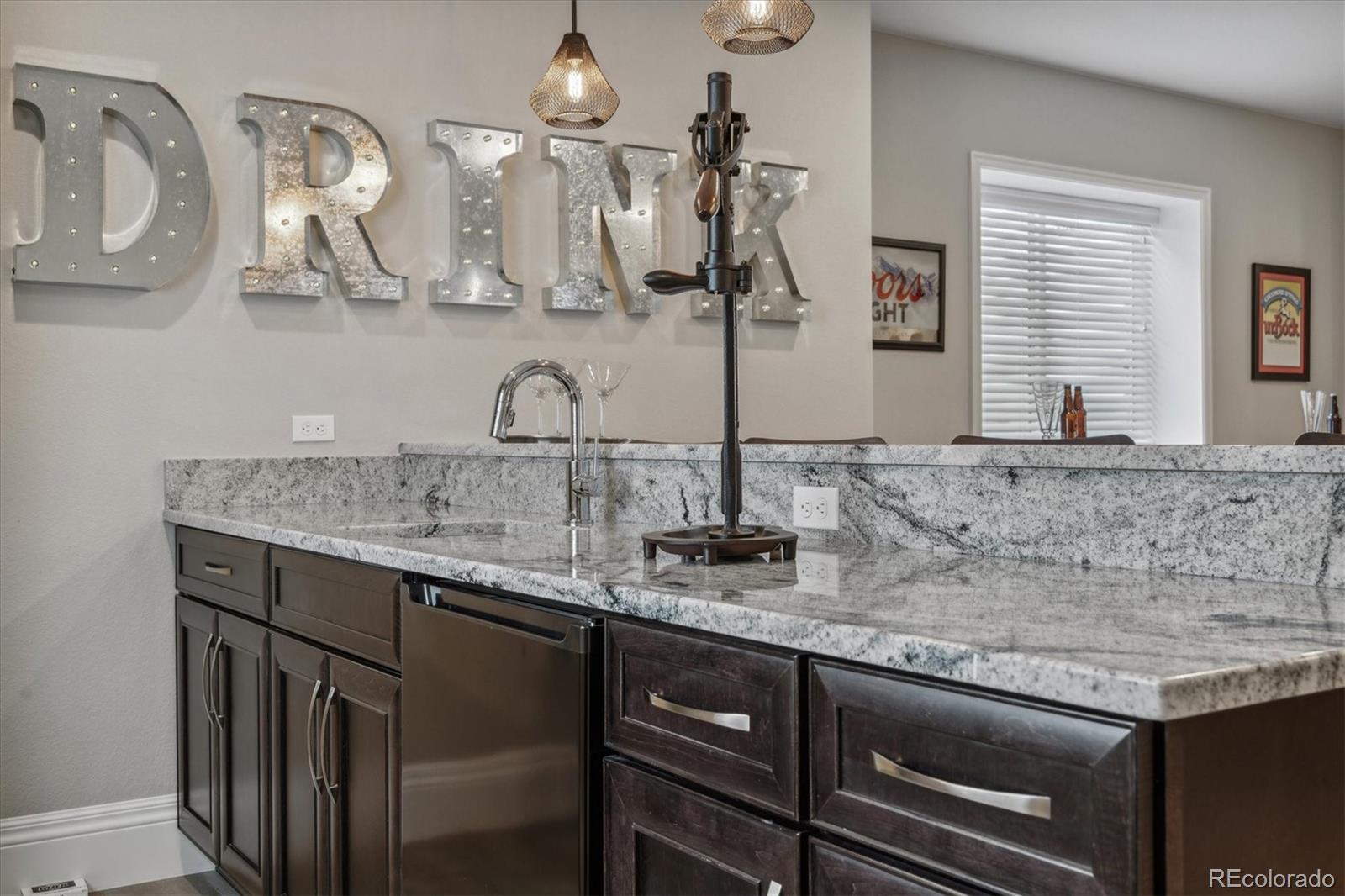 4837 Hogback Ridge Road Morrison, CO 80465 - Photo 27 of 40 a kitchen with sink and cabinets