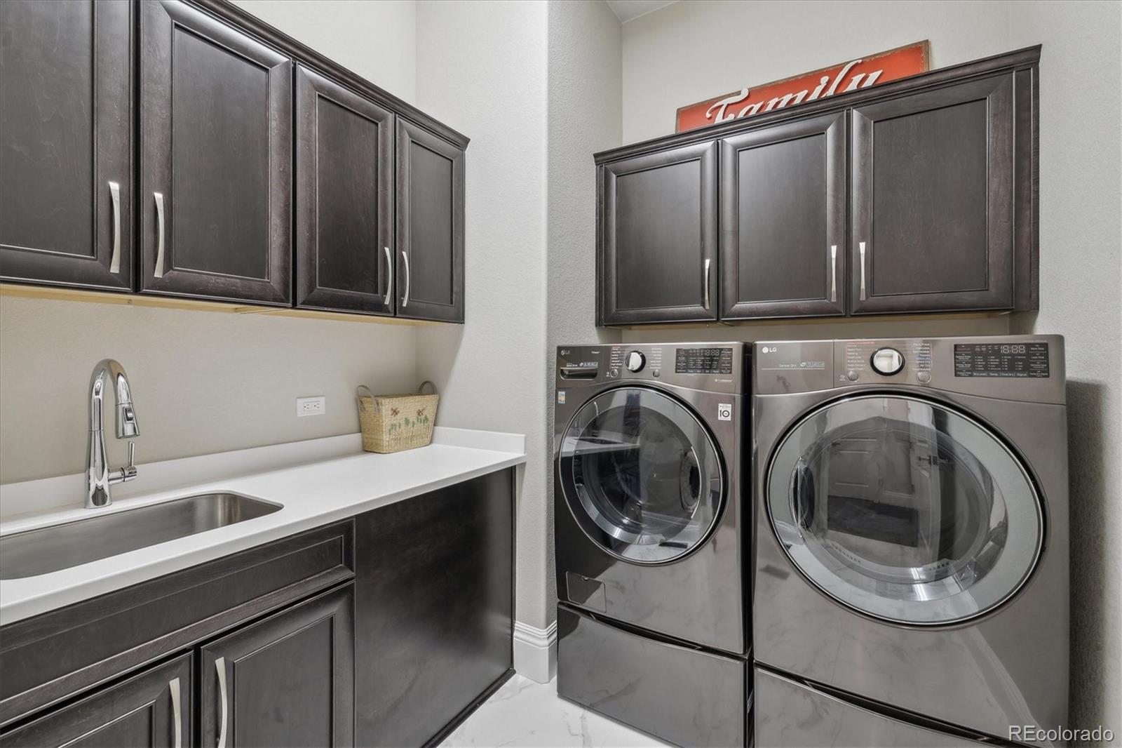 4837 Hogback Ridge Road Morrison, CO 80465 - Photo 31 of 40 a utility room with sink dryer and washer