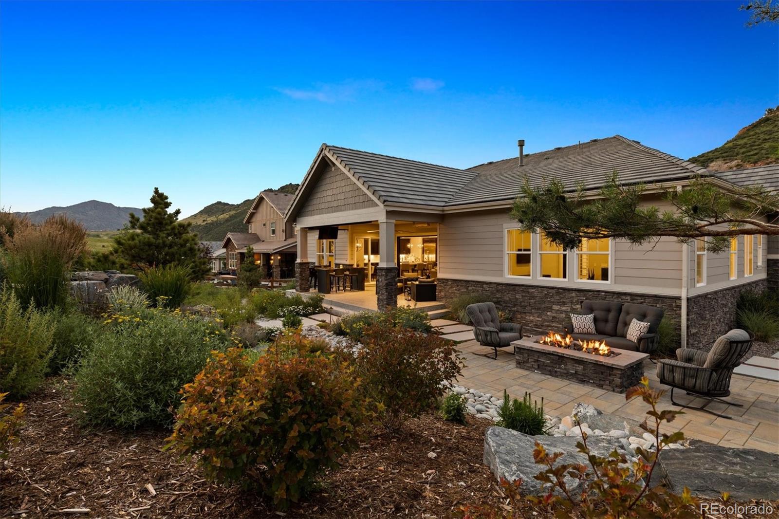4837 Hogback Ridge Road Morrison, CO 80465 - Photo 38 of 40 a front view of a house with a yard