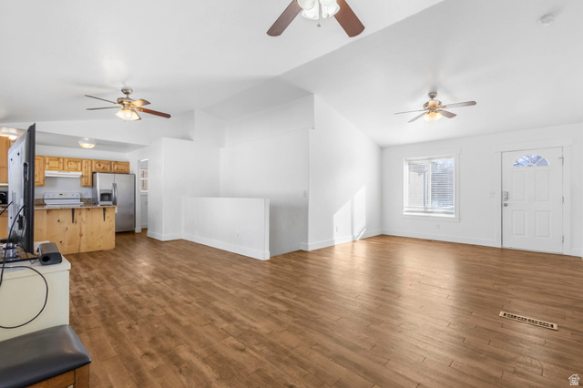1468 South 910 West Payson, UT 84651 - Photo 5 of 25 Unfurnished living room featuring ceiling fan, lofted ceiling, and dark wood-style flooring