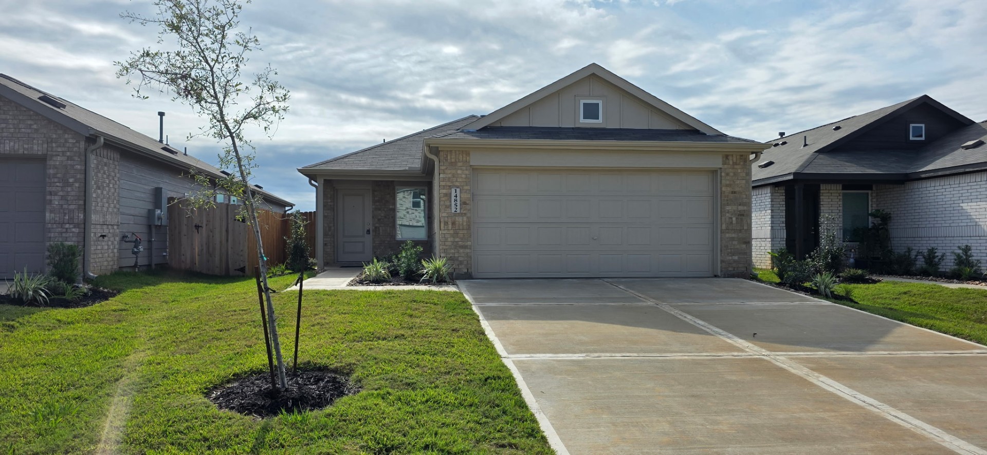 14852 North Ascot Bnd Circle Conroe, TX 77306 - Photo 1 of 21 a front view of a house with a yard
