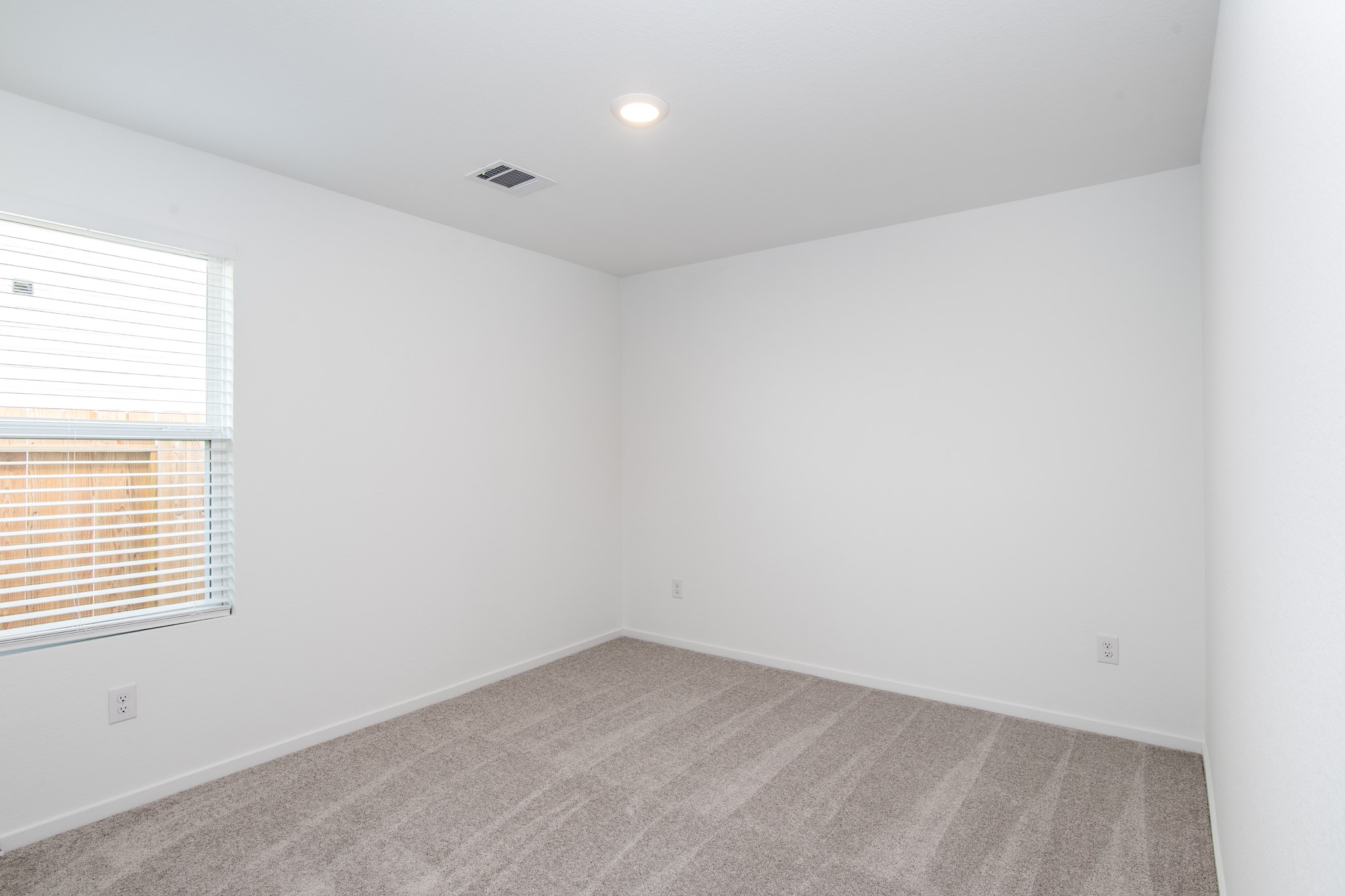 14852 North Ascot Bnd Circle Conroe, TX 77306 - Photo 15 of 21 an empty room with a window