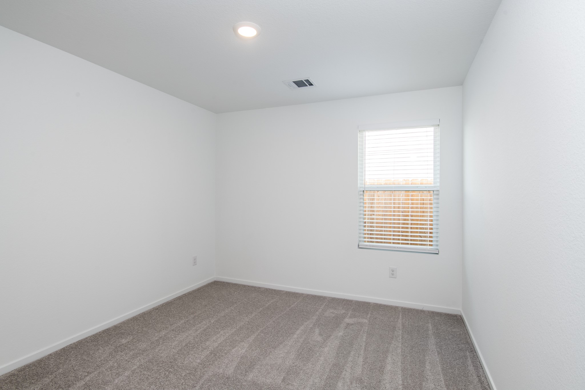 14852 North Ascot Bnd Circle Conroe, TX 77306 - Photo 16 of 21 an empty room with a window