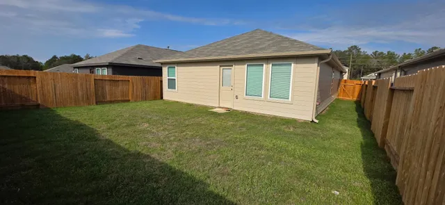 a front view of a house with yard
