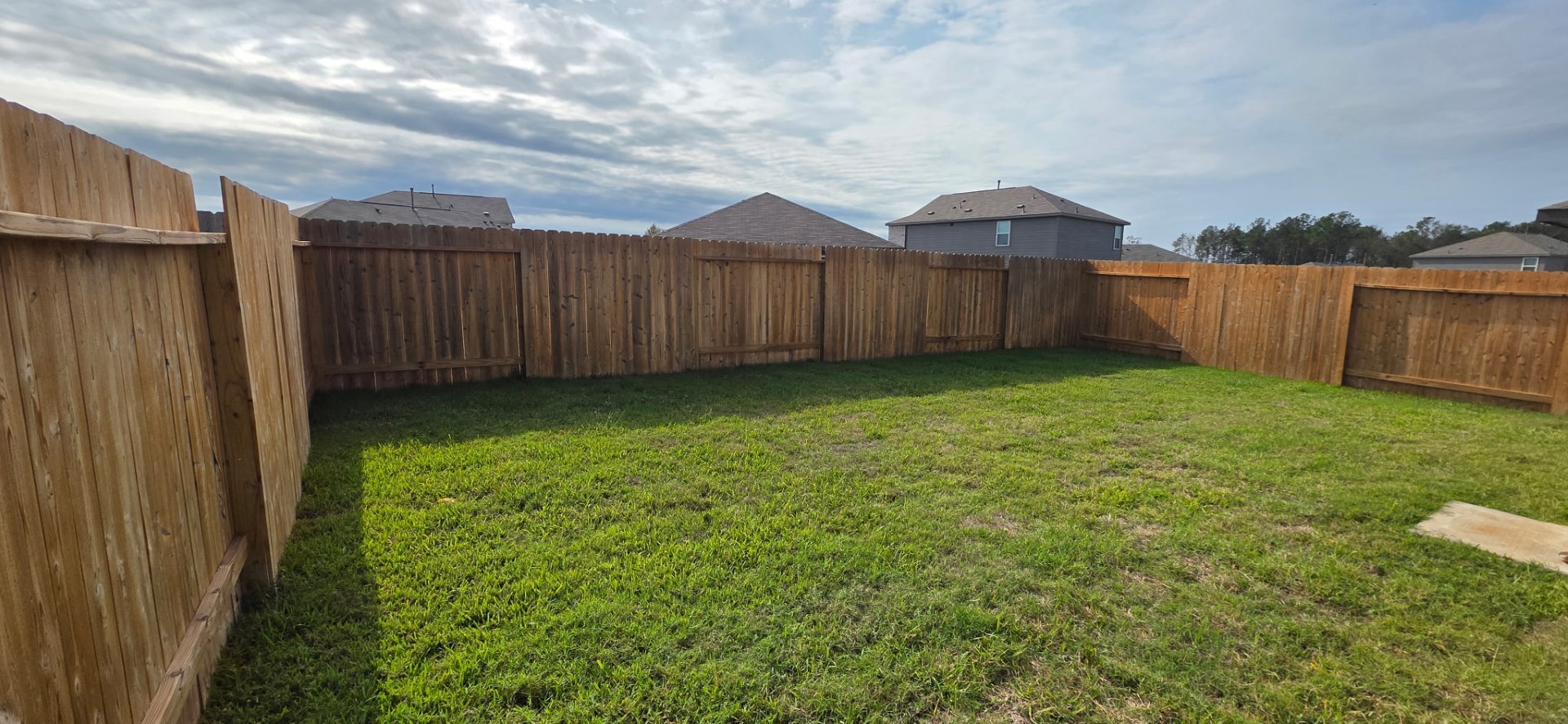 14852 North Ascot Bnd Circle Conroe, TX 77306 - Photo 20 of 21 a view of a backyard with wooden fence