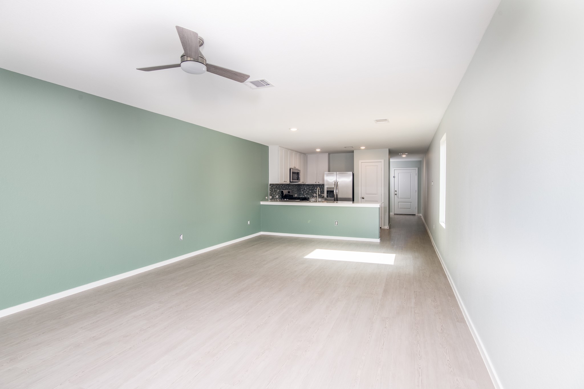 14852 North Ascot Bnd Circle Conroe, TX 77306 - Photo 6 of 21 a view of a kitchen with a sink and a window