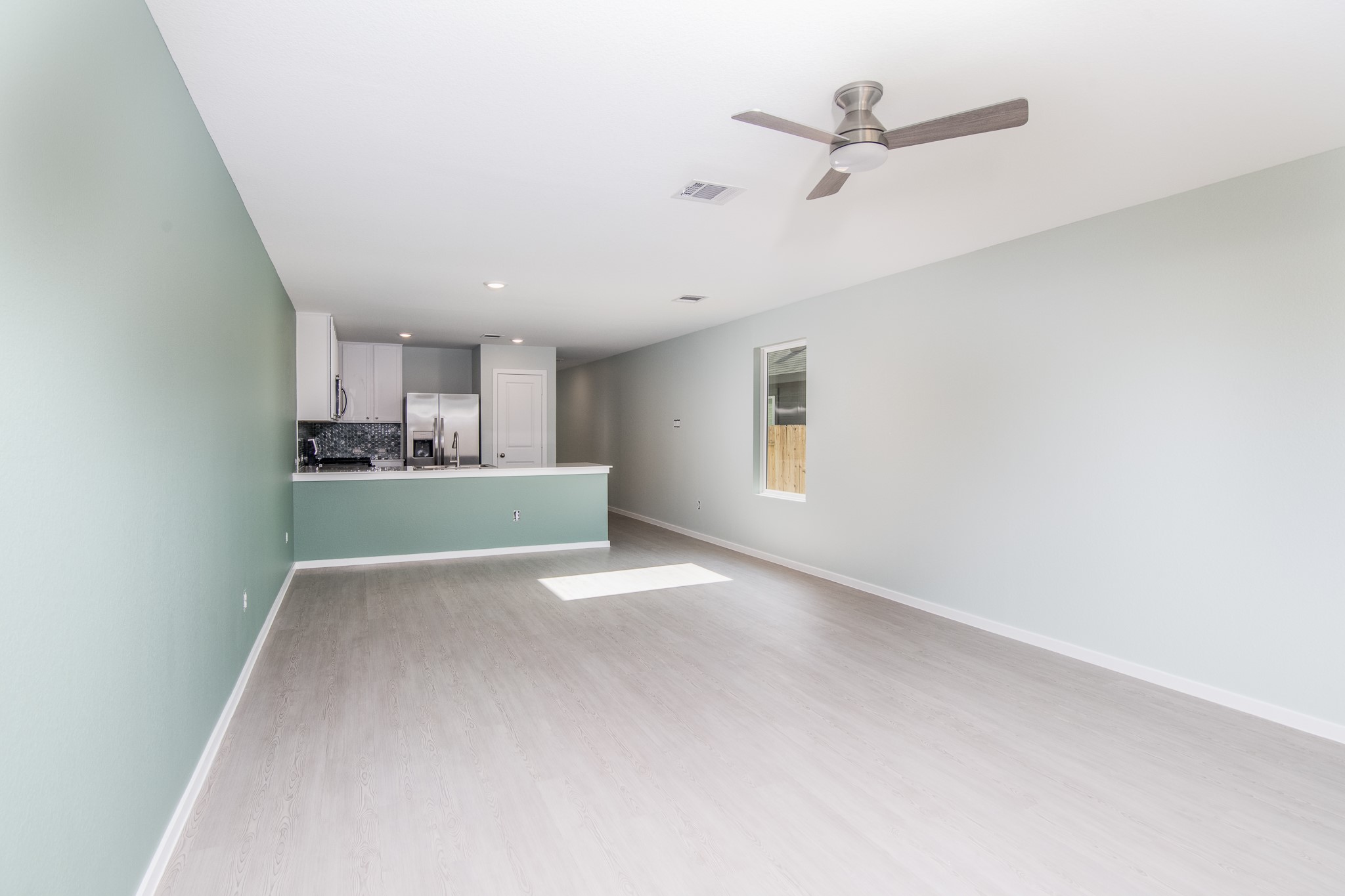 14852 North Ascot Bnd Circle Conroe, TX 77306 - Photo 7 of 21 a view of a kitchen with a sink and cabinets