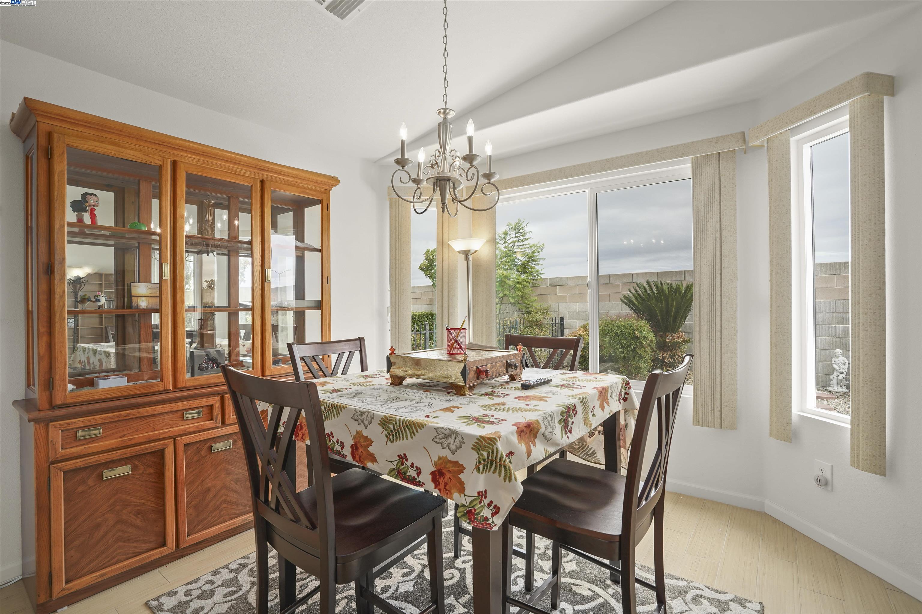 422 Saddle Rock Lane Rio Vista, CA 94571 - Photo 12 of 40 a view of a dining room with furniture large windows and wooden floor