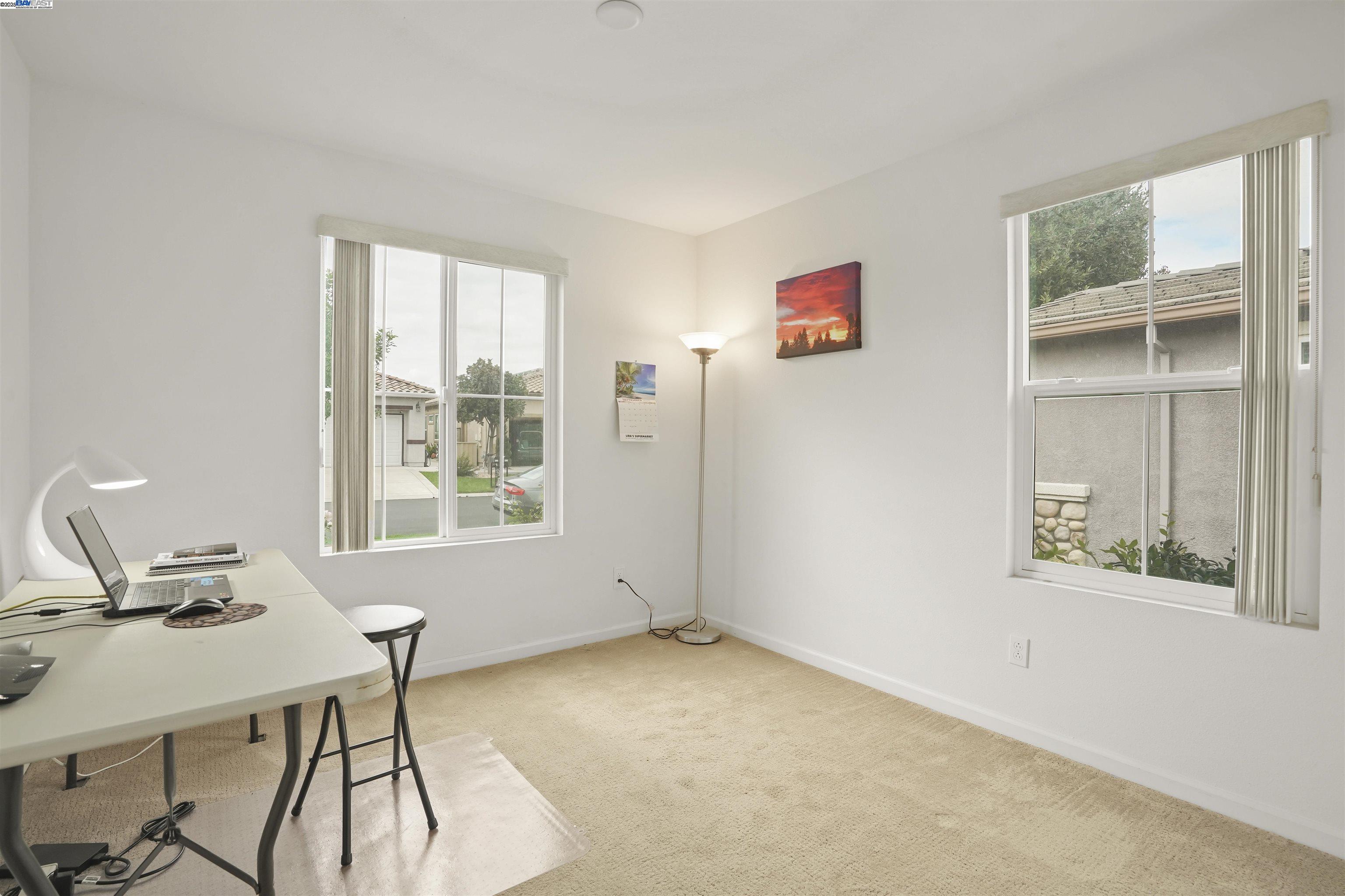 422 Saddle Rock Lane Rio Vista, CA 94571 - Photo 17 of 40 a view of a workspace with furniture and a window