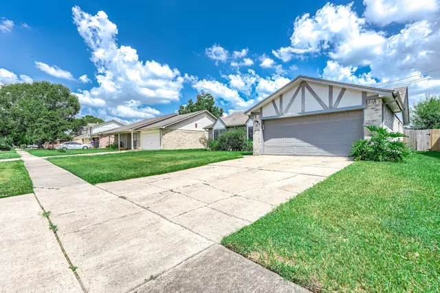 a front view of a house with yard