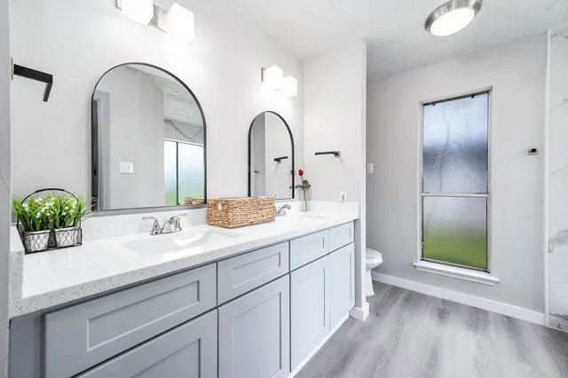 a bathroom with a shower and a mirror
