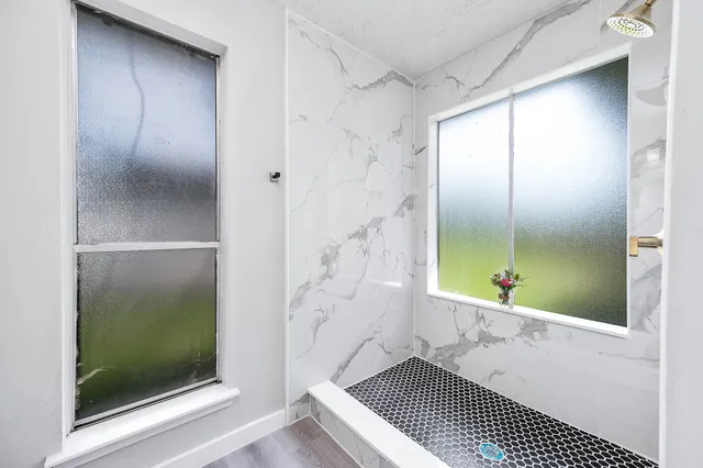 a bathroom with a double vanity sink and a mirror