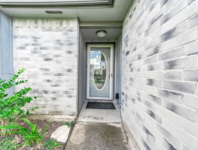 a view of entrance gate of a house with a window
