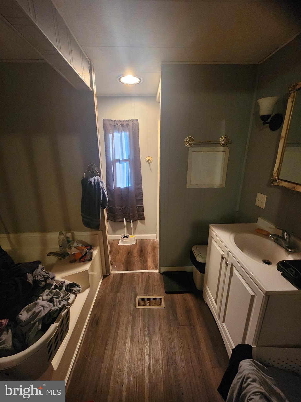 302 Arizona Avenue Williamstown, NJ 08094 - Photo 5 of 11 a kitchen with a sink and wooden floor