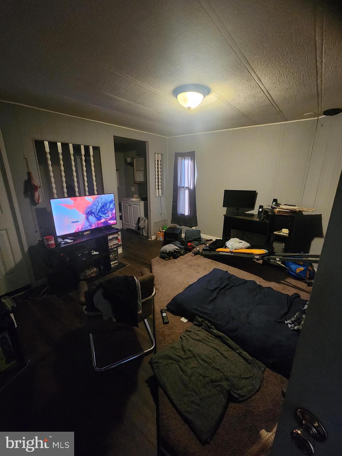 302 Arizona Avenue Williamstown, NJ 08094 - Photo 6 of 11 a bed room with a bed and a television