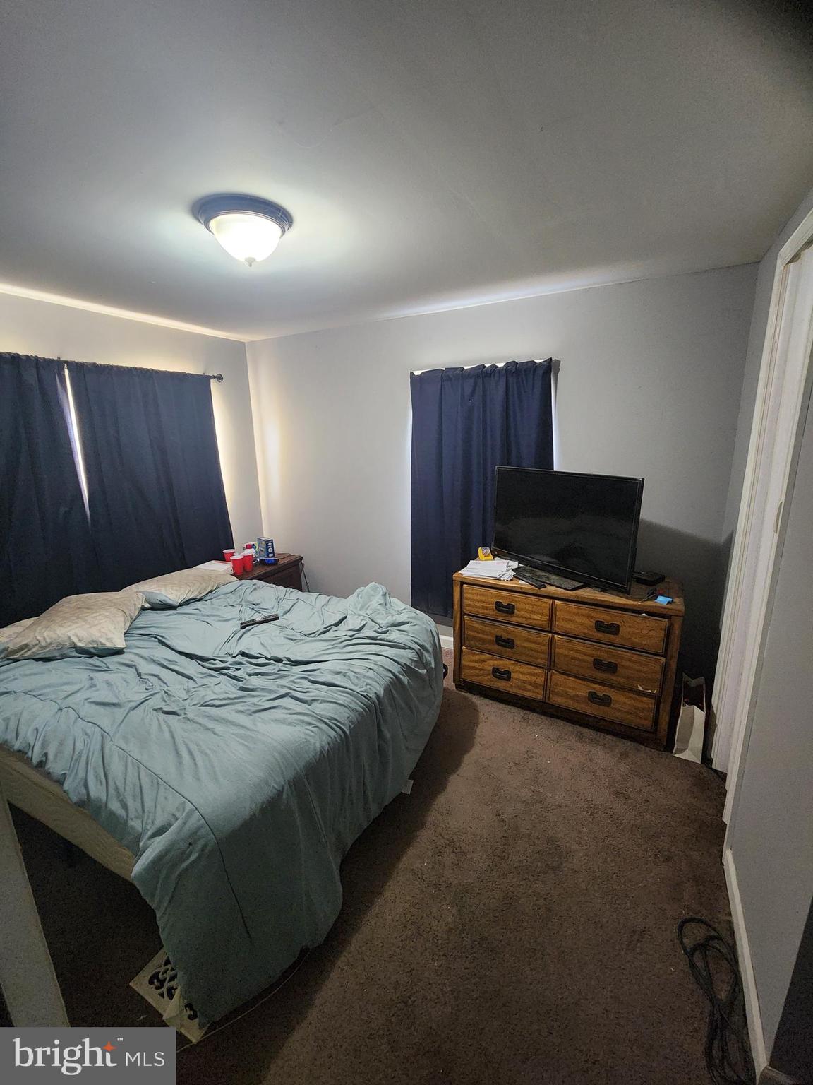 302 Arizona Avenue Williamstown, NJ 08094 - Photo 8 of 11 a bedroom with a bed and a dresser