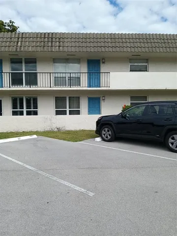 a car parked in front of a building