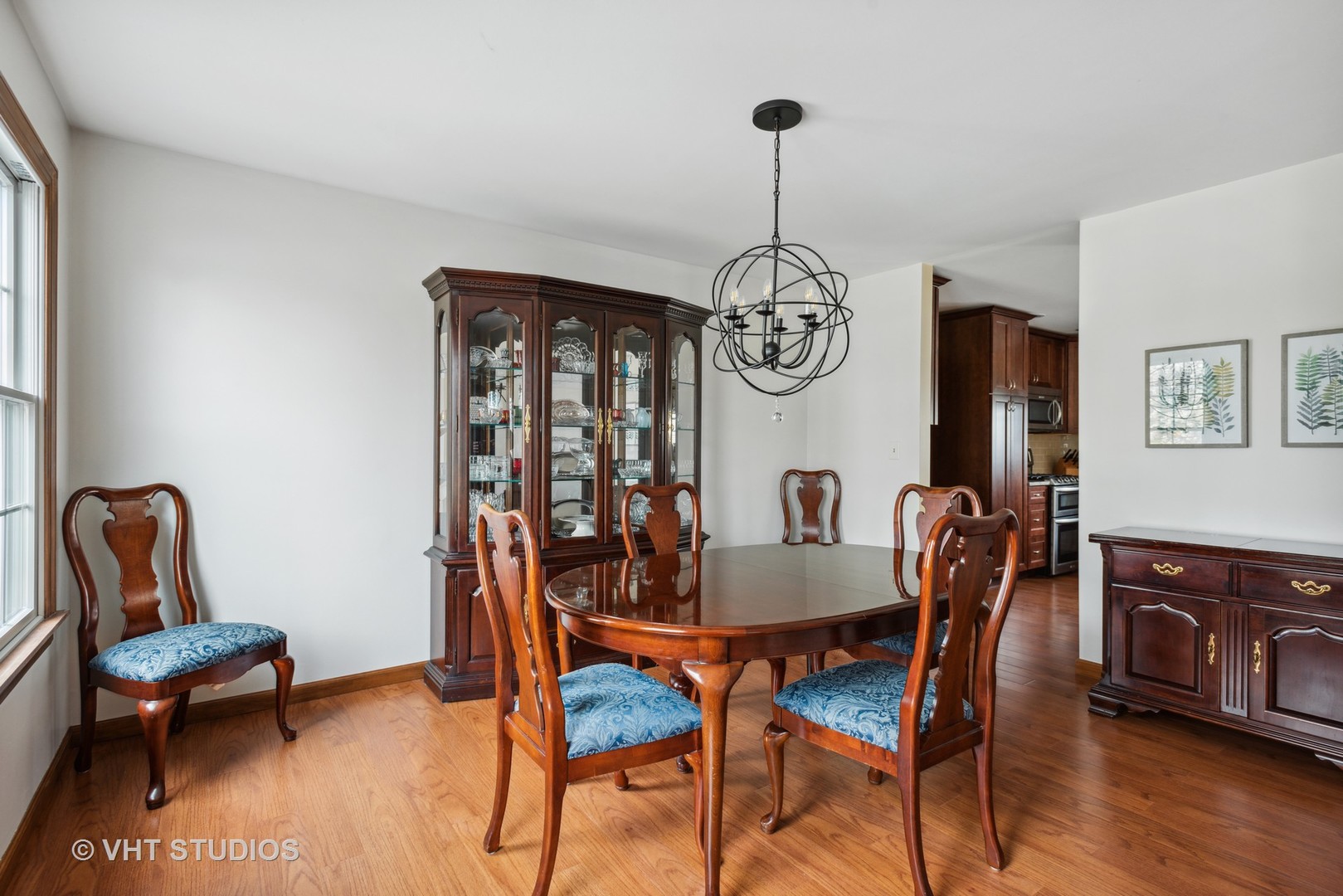 4338 Hatch Lane Lisle, IL 60532 - Photo 13 of 35 a view of a dining room with furniture wooden floor and chandelier