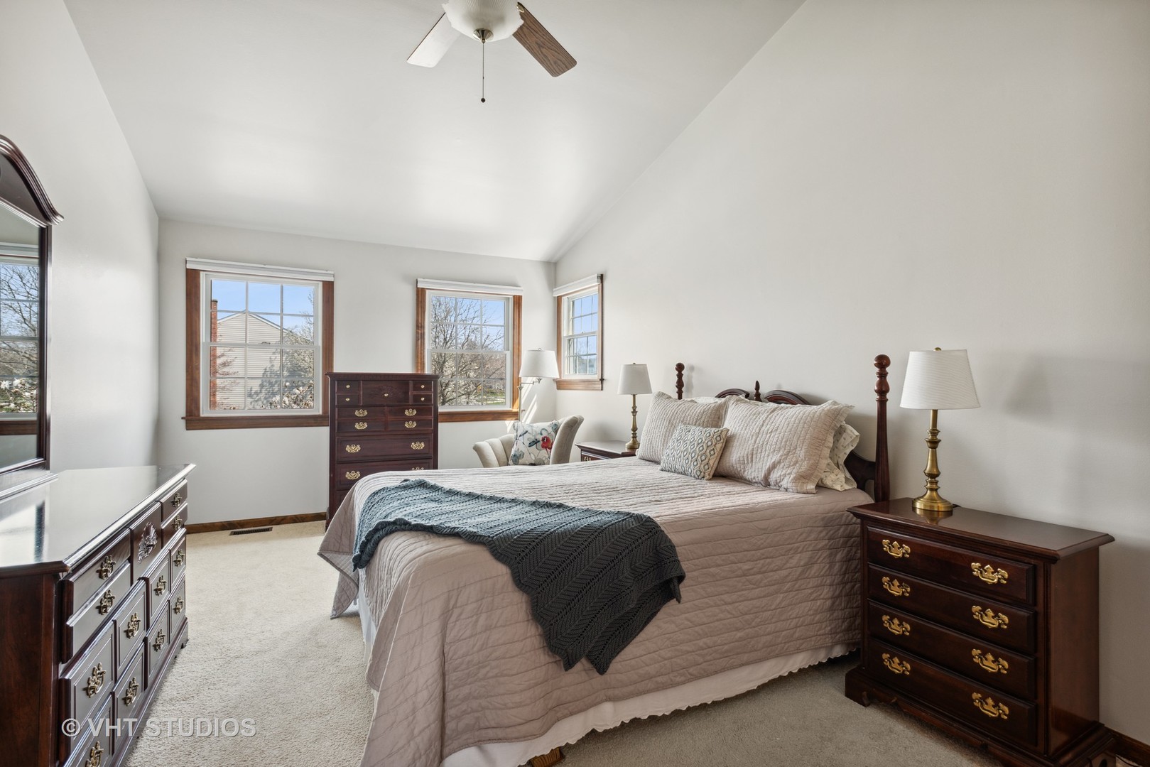 4338 Hatch Lane Lisle, IL 60532 - Photo 14 of 35 a bedroom with a bed a dresser and potted plants with wooden floor