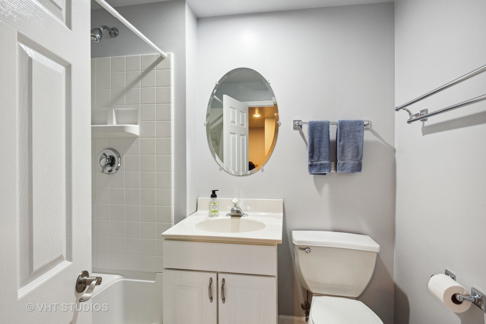 4338 Hatch Lane Lisle, IL 60532 - Photo 24 of 35 a bathroom with a toilet sink and mirror
