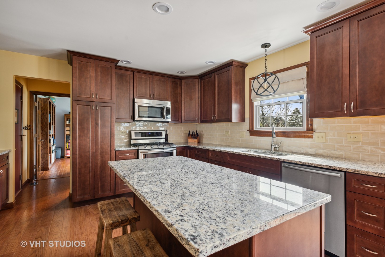 4338 Hatch Lane Lisle, IL 60532 - Photo 8 of 35 a kitchen with stainless steel appliances granite countertop a sink refrigerator and microwave