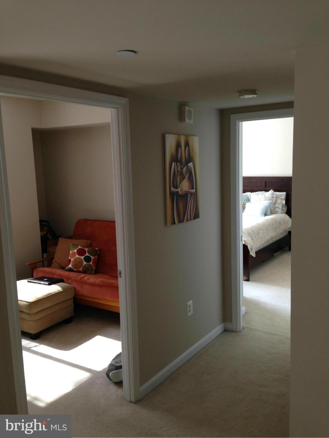 11710 Old Georgetown Road, Unit 1213 North Bethesda, MD 20852 - Photo 11 of 15 a bedroom with furniture and a window