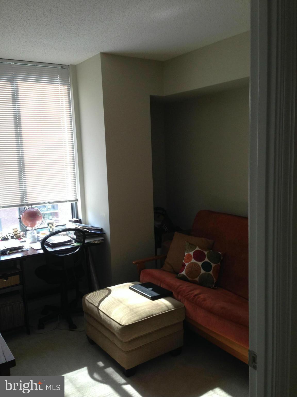 11710 Old Georgetown Road, Unit 1213 North Bethesda, MD 20852 - Photo 9 of 15 a room with a bed and a window