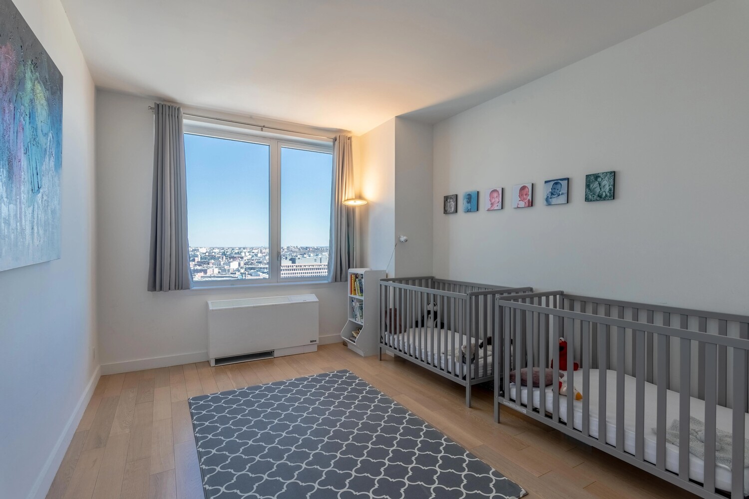 22 North 6th Street, Unit 25D Brooklyn, NY 11249 - Photo 9 of 20 a bedroom with furniture and a window