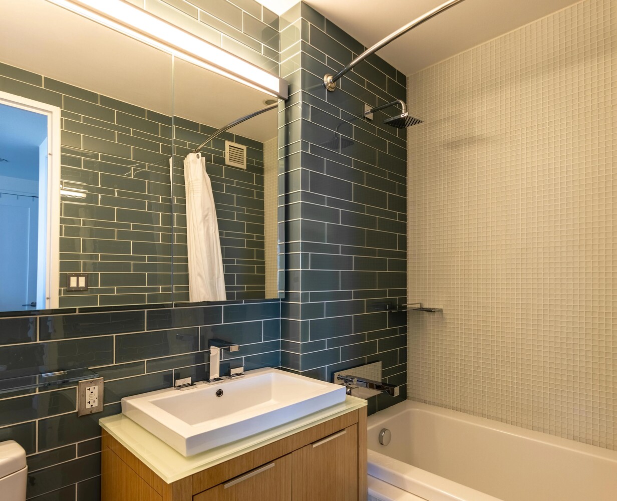 22 North 6th Street, Unit 25D Brooklyn, NY 11249 - Photo 10 of 20 a bathroom with a sink and shower