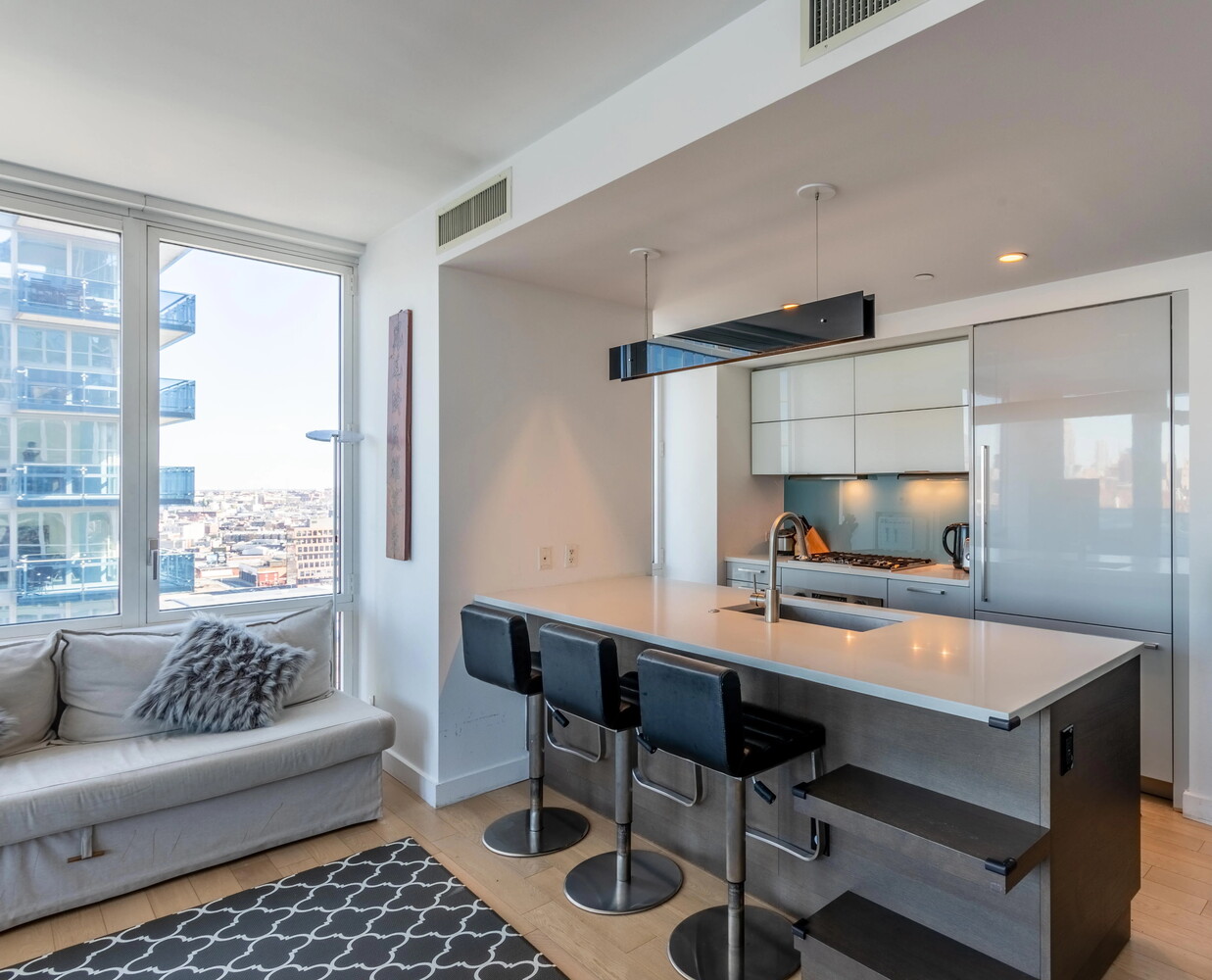 22 North 6th Street, Unit 25D Brooklyn, NY 11249 - Photo 5 of 20 a living room with furniture and a flat screen tv