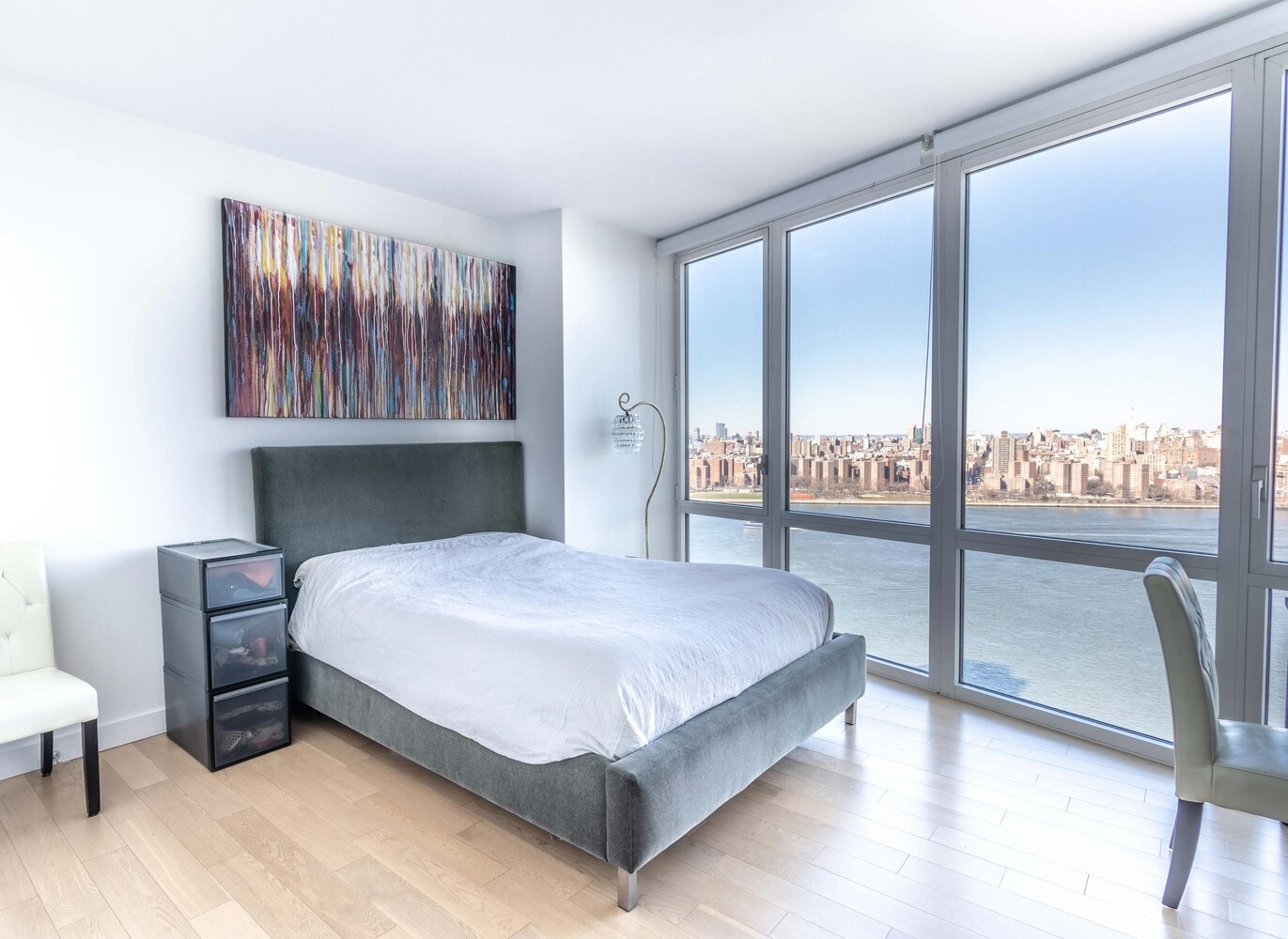 22 North 6th Street, Unit 25D Brooklyn, NY 11249 - Photo 8 of 20 a bedroom with a bed lamp and window