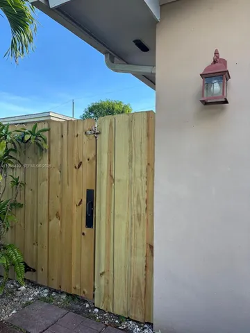 a view of a bathroom with a shower and a sink