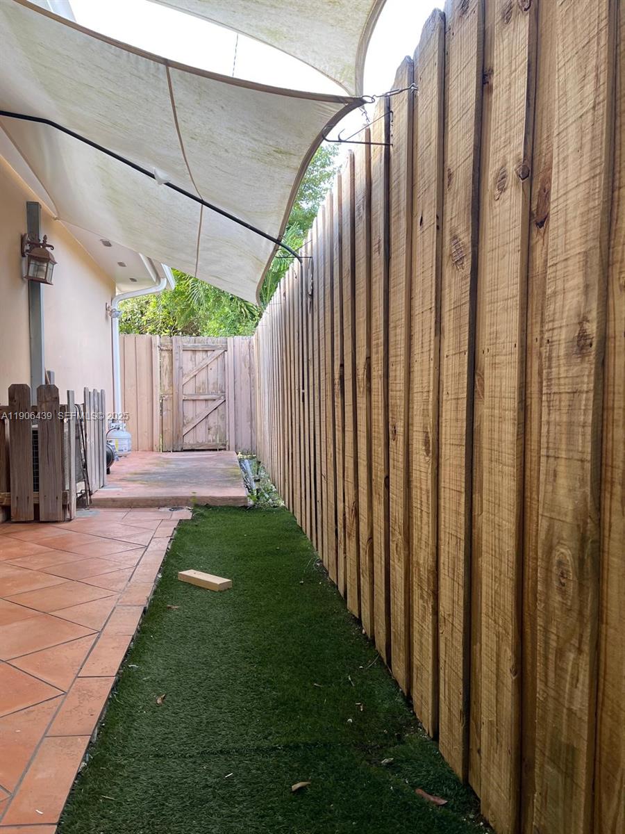 8635 Southwest 102nd Avenue Miami, FL 33173 - Photo 2 of 19 a view of a backyard with wooden fence